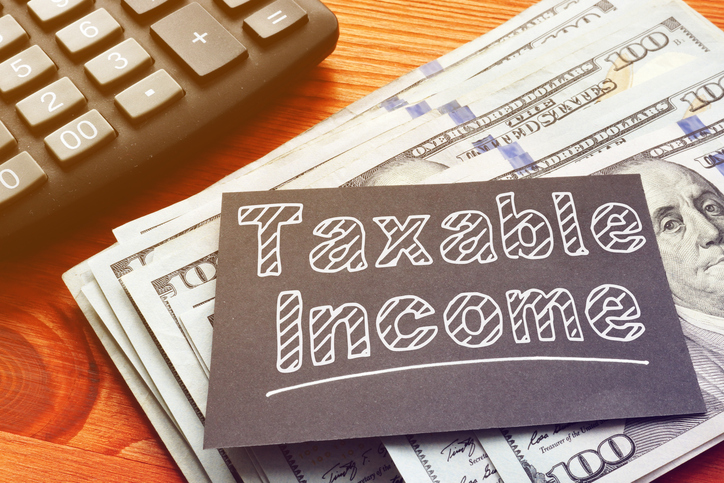 Taxable income is your AGI minus deductions and adjustments, and it’s the number the IRS uses to calculate your tax bill.